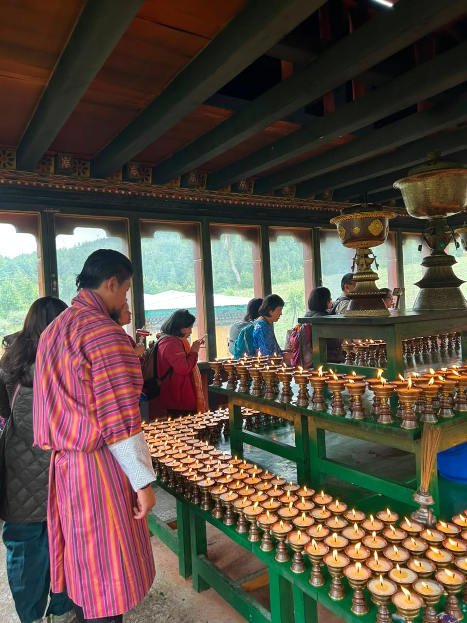 Lighting Butter Lamps at the Temple